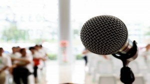 Microphone and audience waiting for presentation Copyright 38796930_123rf.com