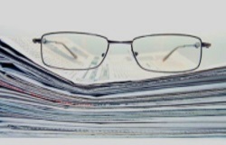 small_business_news_depicted_by_glasses_on_a_pile_of_newspapers_250_5191795_123rf.com